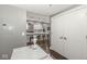 Stylish kitchen with white cabinetry, stainless steel appliances, and bar stool seating at 622 E 10Th St # 206, Indianapolis, IN 46202