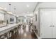 Bright, open-concept living room and kitchen area featuring hardwood floors and modern pendant lighting at 622 E 10Th St # 206, Indianapolis, IN 46202