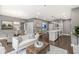 Open concept living space with kitchen, dining, and living areas for entertaining and relaxing at 622 E 10Th St # 206, Indianapolis, IN 46202
