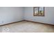Simple bedroom with natural light, neutral carpet, and wood trim at 6744 Robin Hood Ct, Indianapolis, IN 46227