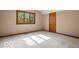 Neutral bedroom with natural light, neutral carpet, and wood trim at 6744 Robin Hood Ct, Indianapolis, IN 46227