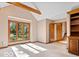 Bright living room filled with natural light from the large window and features a vaulted ceiling at 6744 Robin Hood Ct, Indianapolis, IN 46227