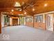 Large recreational room with a ceiling fan, built-in cabinetry, and an abundance of natural light at 6744 Robin Hood Ct, Indianapolis, IN 46227