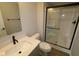 Bright bathroom featuring a large shower with glass doors, modern vanity, and neutral color palette at 7081 Pate Hollow Dr, Brownsburg, IN 46112