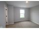 Bright bedroom features carpet, natural light, and neutral paint at 7081 Pate Hollow Dr, Brownsburg, IN 46112