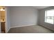 Bright bedroom with soft carpeting, a large window, and great natural light at 7081 Pate Hollow Dr, Brownsburg, IN 46112