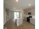 Modern kitchen with stainless appliances, central island, and bright natural light at 7081 Pate Hollow Dr, Brownsburg, IN 46112