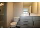 Stylish bathroom with glass-door shower, and a vanity with white countertop and modern fixtures at 7085 Pate Hollow Dr, Brownsburg, IN 46112