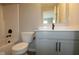 Bright bathroom featuring a tub-shower combo with black hardware and a vanity with white countertop at 7085 Pate Hollow Dr, Brownsburg, IN 46112