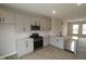 Bright kitchen showcases stainless appliances, sleek countertops, and ample gray cabinet storage at 7085 Pate Hollow Dr, Brownsburg, IN 46112