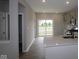 Open-concept design showcases kitchen with an eat-in bar and easy access to the patio at 7085 Pate Hollow Dr, Brownsburg, IN 46112