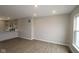 Spacious living area offers an open flow to the kitchen with natural light from a window at 7085 Pate Hollow Dr, Brownsburg, IN 46112