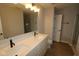 Bathroom featuring a double sink vanity, modern fixtures, and a large mirror at 7089 Pate Hollow Dr, Brownsburg, IN 46112
