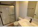 Modern bathroom with glass-enclosed shower, sleek vanity, and contemporary fixtures at 7089 Pate Hollow Dr, Brownsburg, IN 46112