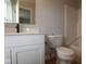 This bathroom features a white vanity, black fixtures, and vinyl floors at 7089 Pate Hollow Dr, Brownsburg, IN 46112