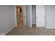 This carpeted bedroom has easy access to a hallway and closet at 7089 Pate Hollow Dr, Brownsburg, IN 46112