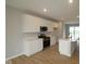Modern kitchen featuring stainless steel appliances, quartz countertops, and ample cabinet space at 7089 Pate Hollow Dr, Brownsburg, IN 46112