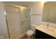 Bathroom with shower and glass door, toilet, and modern sink and counter at 7093 Pate Hollow Dr, Brownsburg, IN 46112