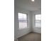 Cozy bedroom featuring carpet floors and lots of natural light from two windows at 7093 Pate Hollow Dr, Brownsburg, IN 46112
