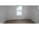 Neutral bedroom with a large window allowing ample natural light at 7093 Pate Hollow Dr, Brownsburg, IN 46112