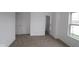 Spacious bedroom with neutral carpet, closet, and ample natural light at 7093 Pate Hollow Dr, Brownsburg, IN 46112