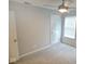 This bedroom features a ceiling fan, plush carpet, and a window for natural light at 788 Tulip Ln, Greenwood, IN 46143