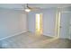 Relaxing bedroom with carpet, a ceiling fan, and views into the hallway and a doorway at 788 Tulip Ln, Greenwood, IN 46143