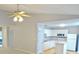 Open concept kitchen with white cabinetry, modern appliances, and a ceiling fan at 788 Tulip Ln, Greenwood, IN 46143