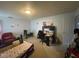 Spacious bedroom setup with a desk, chair, and seating area, featuring neutral-toned walls and carpet at 8033 Lake Tree Cir, Indianapolis, IN 46217