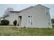 Side view of a two-story home with vinyl siding and well-maintained landscaping at 8033 Lake Tree Cir, Indianapolis, IN 46217