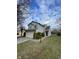 Charming two-story home with a manicured lawn and an attached two-car garage at 8033 Lake Tree Cir, Indianapolis, IN 46217