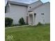A charming two-story home with neutral siding and a well-manicured lawn at 8033 Lake Tree Cir, Indianapolis, IN 46217