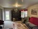 Spacious living area with TV, seating, rear yard access and natural light at 8033 Lake Tree Cir, Indianapolis, IN 46217