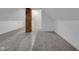 Attic space with brick column, carpet and three doors at 843 N Oxford St, Indianapolis, IN 46201