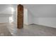Attic space with brick column, carpet and three doors at 843 N Oxford St, Indianapolis, IN 46201