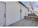 Exterior of home with a wooden deck and white siding at 843 N Oxford St, Indianapolis, IN 46201