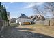Home exterior with spacious backyard and partial fence at 843 N Oxford St, Indianapolis, IN 46201