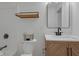 Bright bathroom features a vanity with modern fixtures and rectangular mirror at 843 N Oxford St, Indianapolis, IN 46201
