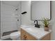 Modern bathroom with white subway tile shower and herringbone vanity at 843 N Oxford St, Indianapolis, IN 46201