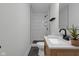 Modern bathroom featuring a sleek vanity, stylish fixtures, and a tiled walk-in shower at 843 N Oxford St, Indianapolis, IN 46201