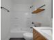 Bright bathroom features a shower-tub combo, updated vanity and modern fixtures at 843 N Oxford St, Indianapolis, IN 46201