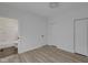 Bedroom features wood floors and 3 doors, one leading to bathroom at 843 N Oxford St, Indianapolis, IN 46201