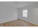 Bright bedroom with modern panel wall design and wood floors at 843 N Oxford St, Indianapolis, IN 46201