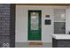 Up-close view of the home's elegant green front door with decorative glass and modern hardware at 843 N Oxford St, Indianapolis, IN 46201