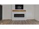 Living room showcasing a modern electric fireplace with a wooden mantle and sleek wall-mounted TV at 843 N Oxford St, Indianapolis, IN 46201