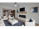 Bright and modern living room featuring a sleek fireplace and an open-concept design at 843 N Oxford St, Indianapolis, IN 46201