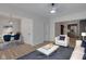 Bright living room with new wood floors, open to a dining area and modern kitchen at 843 N Oxford St, Indianapolis, IN 46201