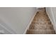 Carpeted stairway is prepped with plastic coverings for renovation at 843 N Oxford St, Indianapolis, IN 46201