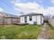 Backyard featuring a wooden deck, grass and partial fence at 928 E Pleasant Run Parkway North Dr, Indianapolis, IN 46203