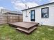 Backyard featuring a wooden deck, grass and partial fence at 928 E Pleasant Run Parkway North Dr, Indianapolis, IN 46203